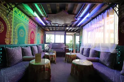 a living room with purple couches and colorful walls at Dar Belmamoun in Fès