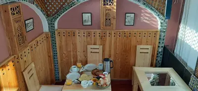a small room with a table in a doll house at Dar Belmamoun in Fès