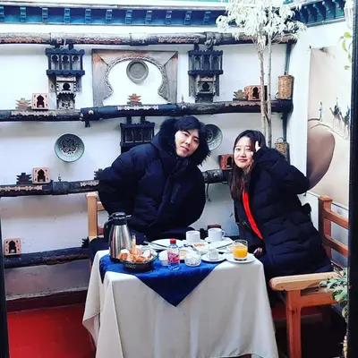 a man and a woman sitting at a table at Dar Belmamoun in Fès