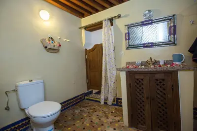 a bathroom with a toilet and a sink at Riad Zina Fes - Elegance in the Heart of Fes in Fès