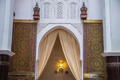 an archway in a building with a light on it at Riad Zina Fes - Elegance in the Heart of Fes in Fès