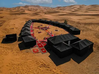 an aerial view of a desert with a stage at Auberge Bivouac La Belle Etoile in Merzouga