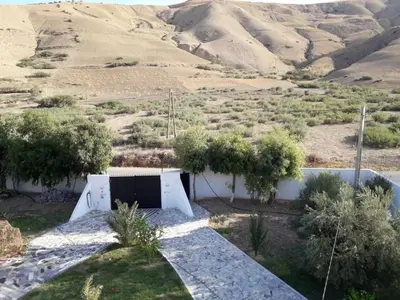 a house in the desert with a view of the mountains at BELLE MAISON AU COEUR DES MONTAGNES DE TAZA à moins de 10 minutes de l'AGORA PARK in Taza