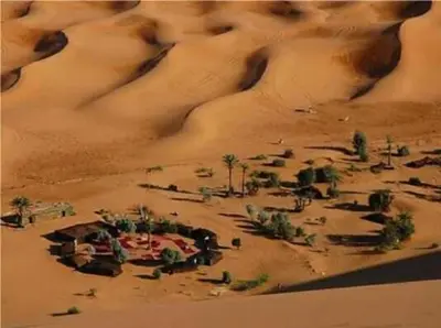 a model of a desert with a village in the sand at Chez zakaria luxury camp merzouga in Merzouga