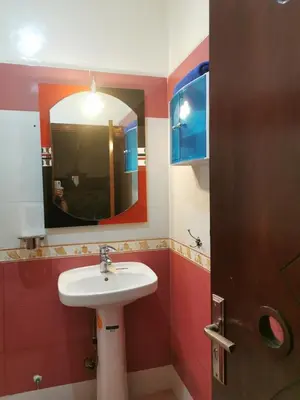 a bathroom with a sink and a mirror at Adam's House-moroccan style in Fès
