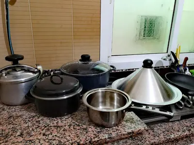 a kitchen counter with pots and pans on a stove at Adam's House-moroccan style in Fès