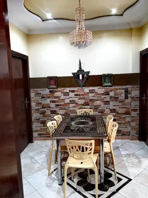 a dining room with a table and chairs at Adam's House-moroccan style in Fès