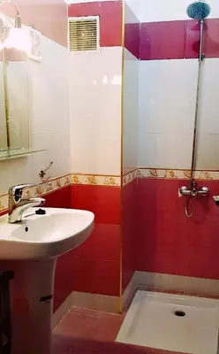 a bathroom with a sink and a shower at Adam's House-moroccan style in Fès