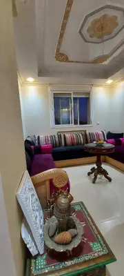 a living room with a couch and a table at حدائق إفران in Ifrane