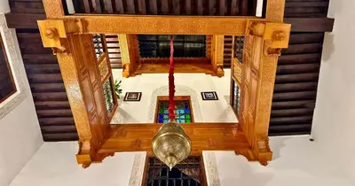 an overhead view of a spiral stairway with a church at Riad Le Petit Patrimoine De Fés in Fès