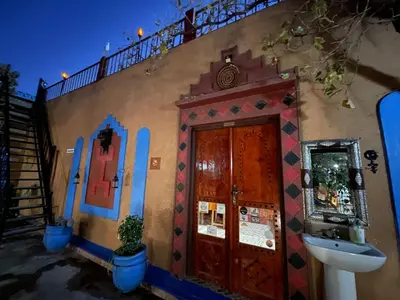 a building with a sink on the side of it at Riad Dades Birds in Boumalne