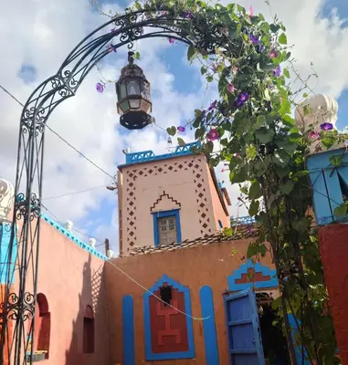 a church with a street light on top of it at Riad Dades Birds in Boumalne