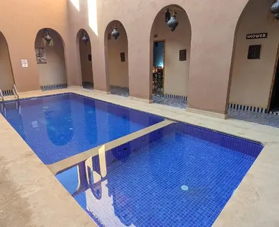 a large swimming pool in a building at Dar fatima merzouga in Merzouga