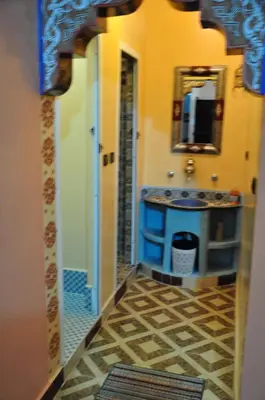 a bathroom with a sink and a mirror at Dar fatima merzouga in Merzouga