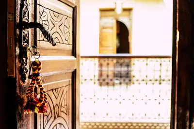 an open door with a door knob and a door at Riad Caravasar in Merzouga