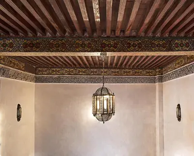 a chandelier hanging from a ceiling in a room at Dar Drissi in Fès