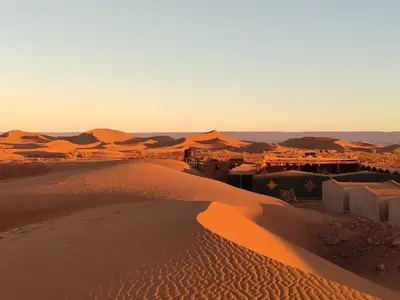 an aerial view of a desert with sand dunes at Desert Bivouac Mhamid in Mhamid