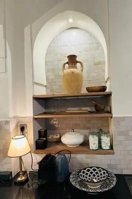 a shelf with a vase sitting on top of it at Villa Magtafa in Marrakech