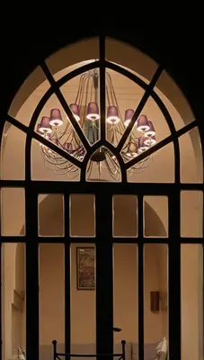 a view of a window with a chandelier at Villa Magtafa in Marrakech