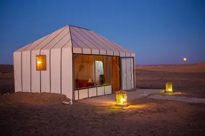 a small tent in the middle of the desert at Luxury Desert Queen Camp in Merzouga