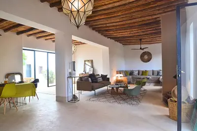 a living room with a couch and a table at La Villa douce in Marrakech
