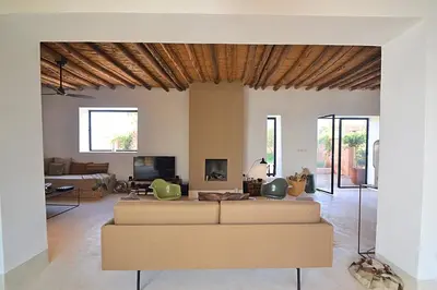 a living room with a couch and a tv at La Villa douce in Marrakech