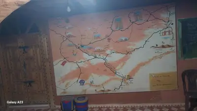 a large map on the wall of a classroom at Maroc Galacx in Ouarzazate