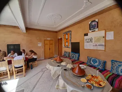 a restaurant with two tables with food on it at ZEN ECOLODGE in Tighli