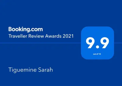 a screenshot of a phone with the travel review awards at Tiguemine Sarah in Marrakech