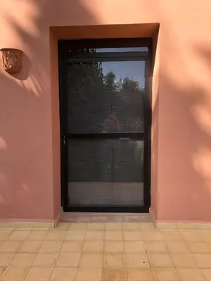 a room with a window with blinds at Tiguemine Sarah in Marrakech