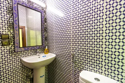 a bathroom with a sink and a mirror at Dar Layali Fez in Fès
