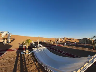 a hammock in the middle of the desert at Nomads Dunes Nest in Merzouga