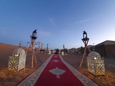 a red carpet in the middle of the desert at Nomads Dunes Nest in Merzouga