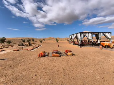 a group of pumpkins on the ground in the desert at Luxury Bega Camp in Merzouga