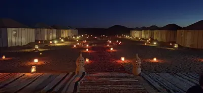 a group of candles on a beach at night at Sun Bivouac Chegaga in El Gouera