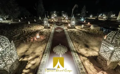 a winter park covered in snow at night at Superior Desert Camp in Merzouga