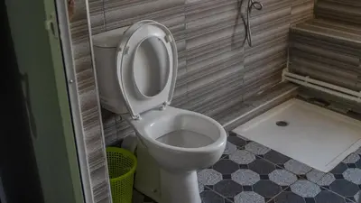 a bathroom with a toilet with the seat up at Gîte Forest Tagroumte in Azrou