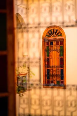 a stained glass door on the side of a building at Riad Al Ansari in Fès