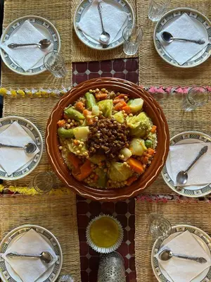 a table with a bowl of food on it at Dar Duna in Hassilabied