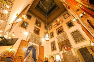 a large room with a church with a ceiling and a room with aurrection at Riad Sahraui in Fès