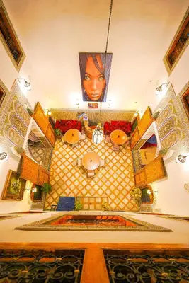 a large room with a large face on the ceiling at Riad Sahraui in Fès