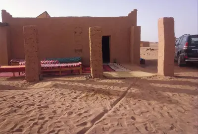 a building in the middle of the desert at Camp Cheri Beri in Mhamid