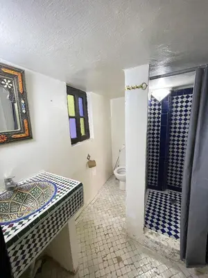 a bathroom with a sink and a toilet in it at Dar Atlantic in Fès