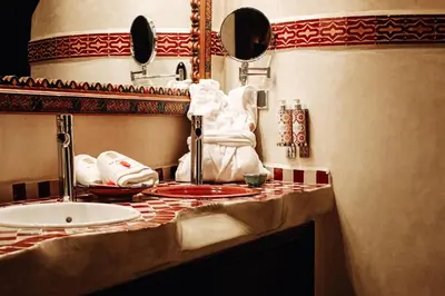 a bathroom with a sink and a counter top at OZ Palace Ouarzazate & SPA in Ouarzazate
