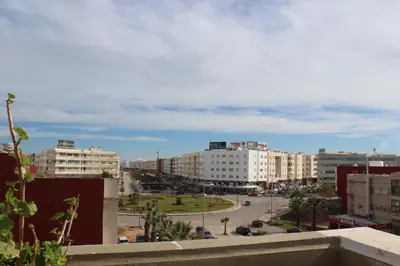 a view of a city with buildings and a street at New Fez Apartments in Fès