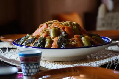 a bowl of food sitting on a table at Berber Nomad Kasbah in Nkob