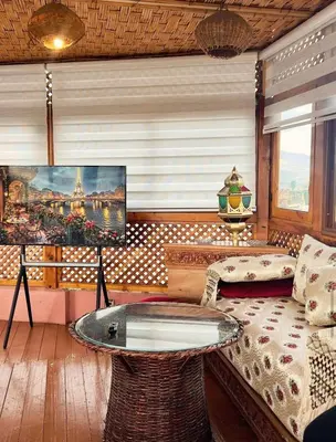 a living room with a couch and a table at Riad Fes Madaw in Fès