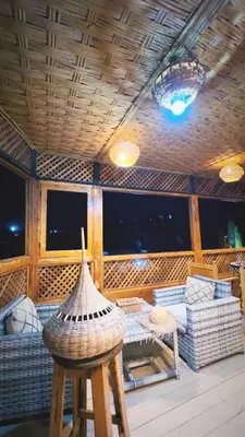 a living room with a couch and a table at Riad Fes Madaw in Fès