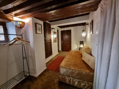 a living room with a couch and a table at Riad Le Sucrier de Fès in Fès