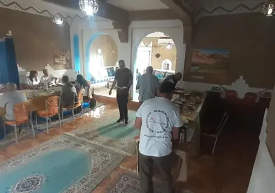 a group of people standing in a room at Casa Laman in Merzouga